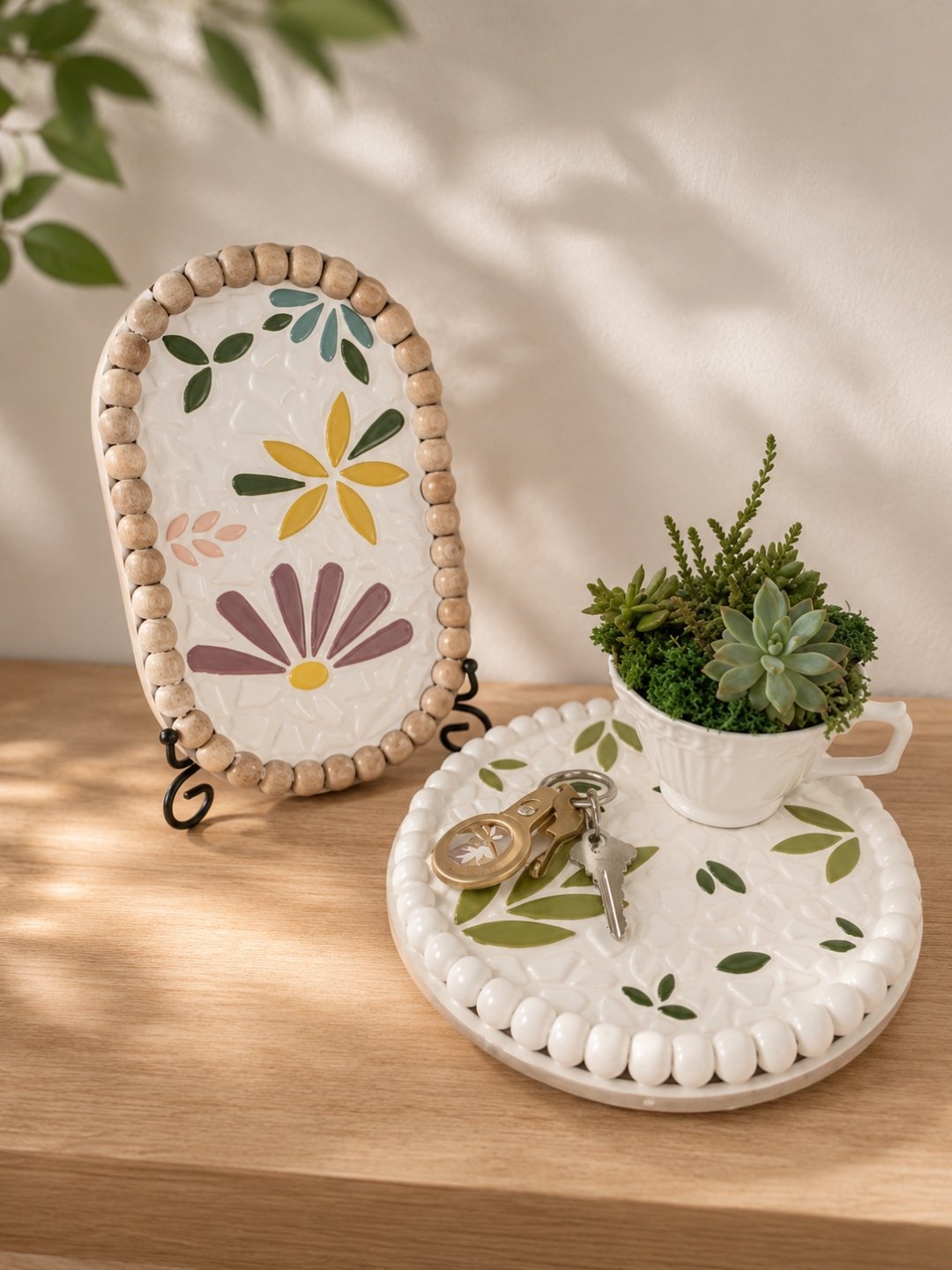 Mosaic plates decorated with hand-cut tile and floral motifs