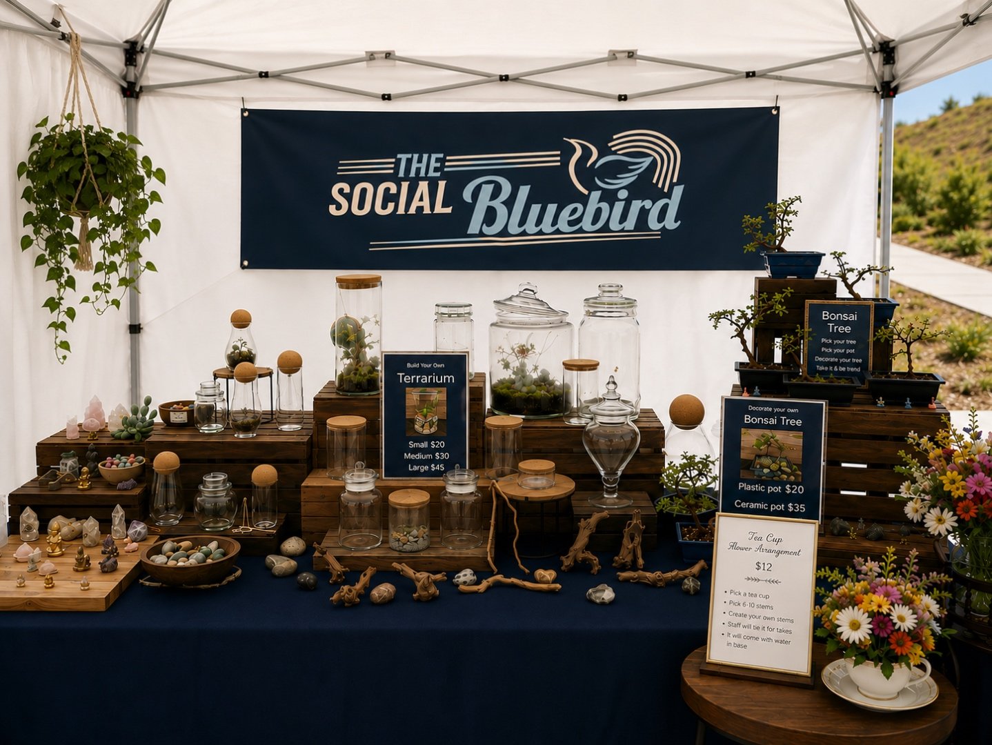A styled booth of terrariums and botanical displays at a market